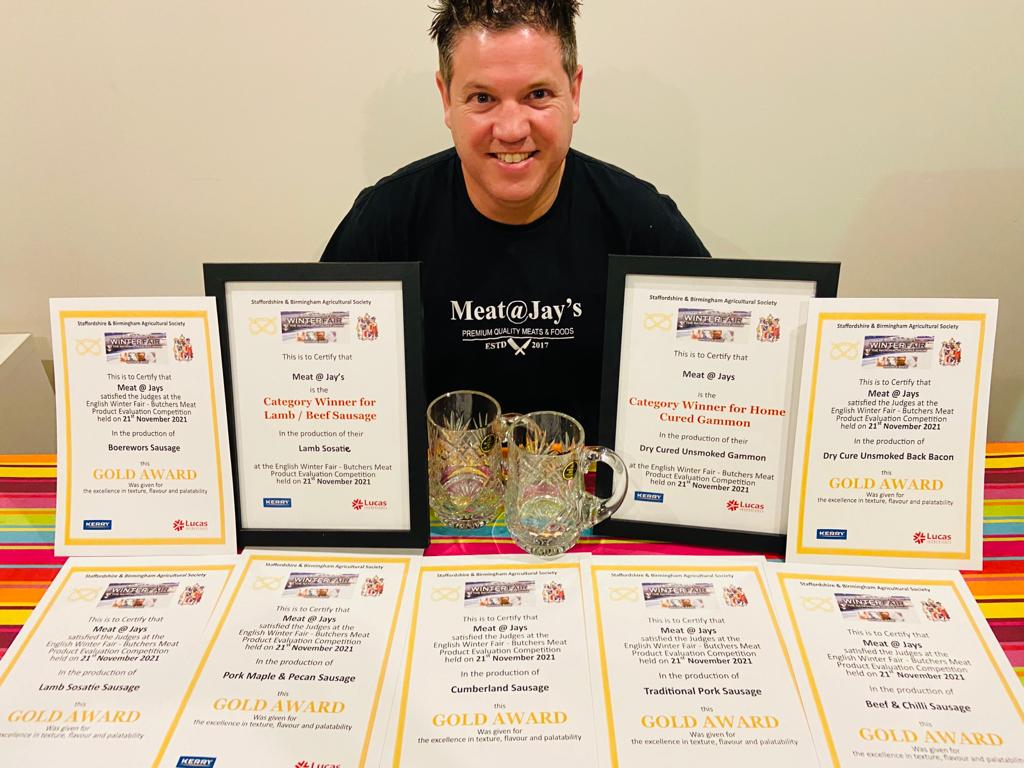 Jay with his award certificates